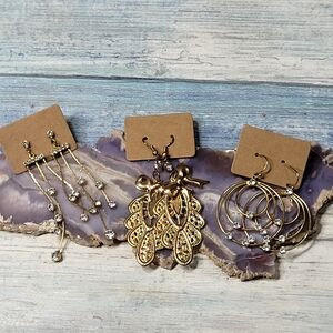 Three Gold with rhinestones Dangle Earrings.
